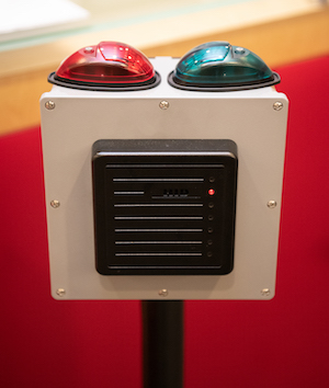 red and green lights on top of pedestal