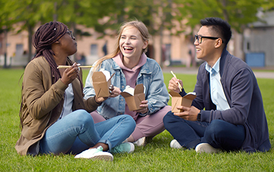 photo of 3 students eating