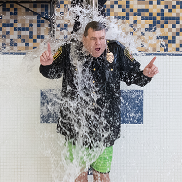 Chief Tom Leone with water being poured on him for the 2021 Polar Bear Plunge