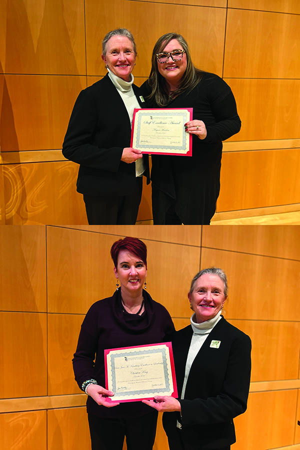 Megan Meadow and Christine King accepting their awards from Dean Kirschling