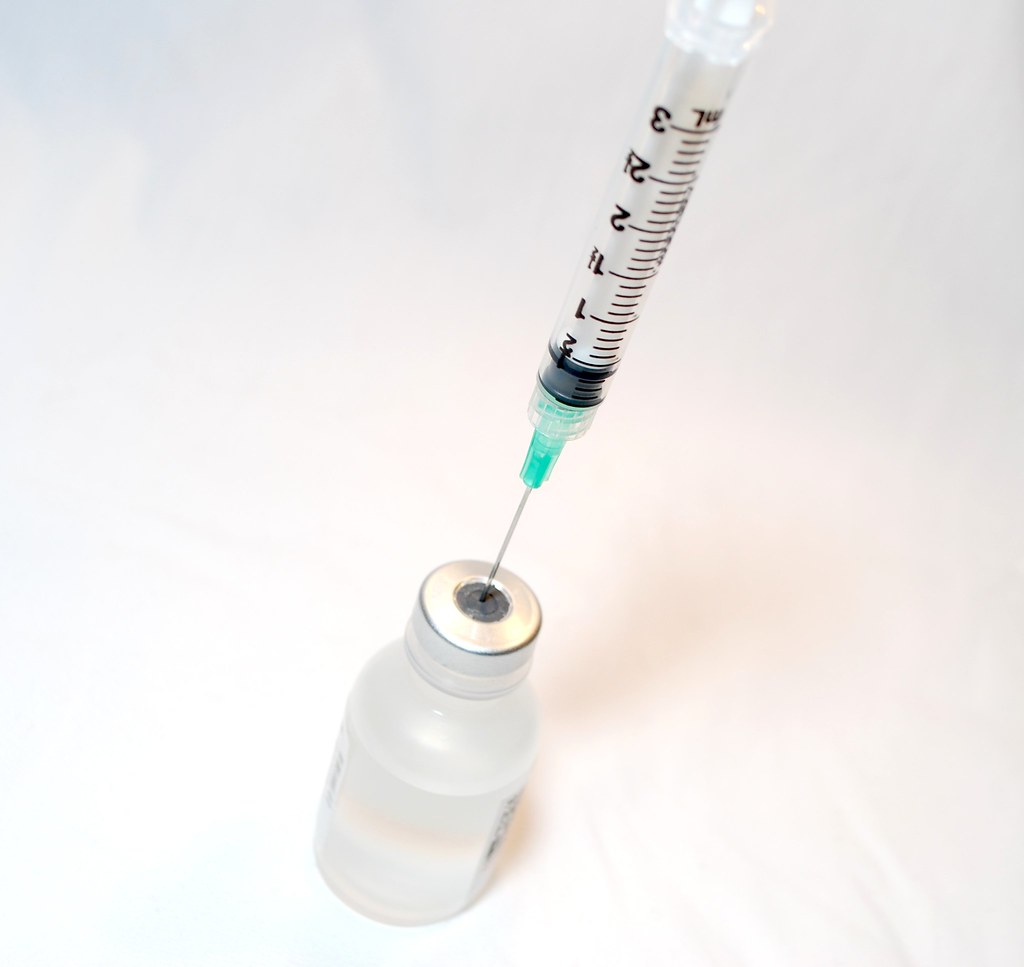 image of vaccine vial and syringe