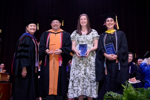Dean Kirschling with Excellence in Teaching Award winners on stage at Convocation 2023