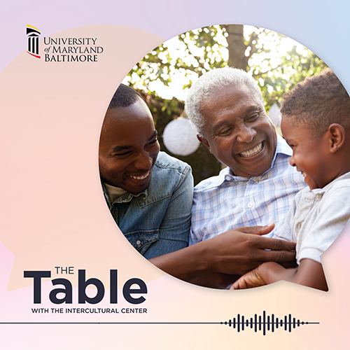 photo of a family of black men smiling at one another with text that says the table with the intercultural center