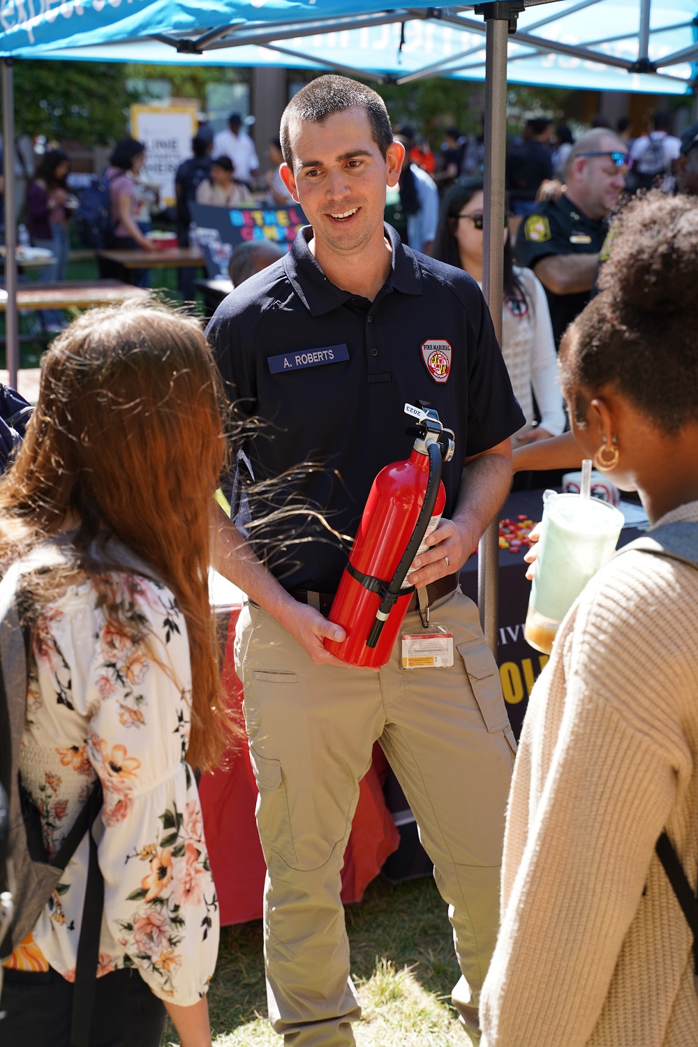 Fire Marshal Andrew Roberts talks with students about fire extinguishers