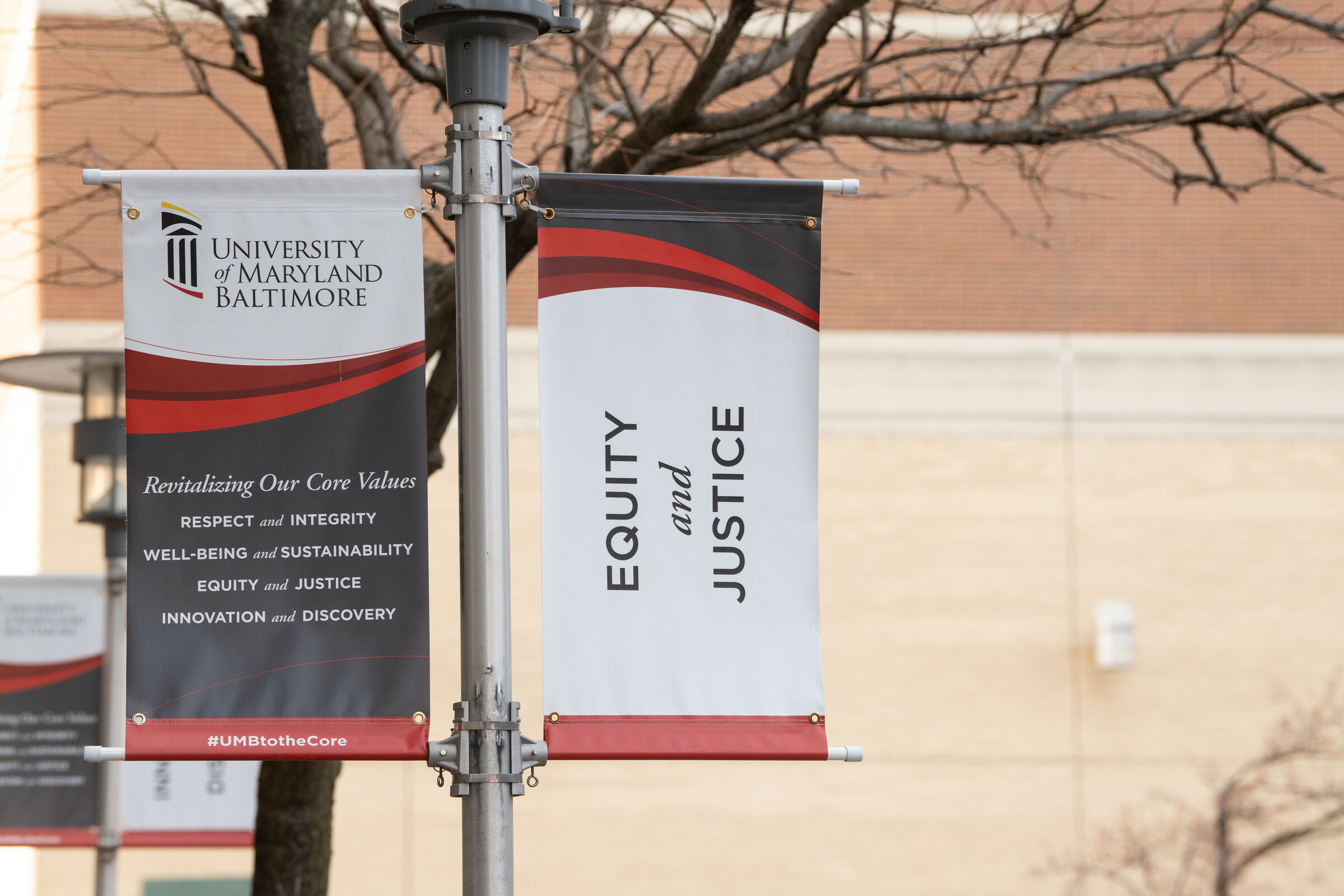 Banner on an outdoor light pole that 