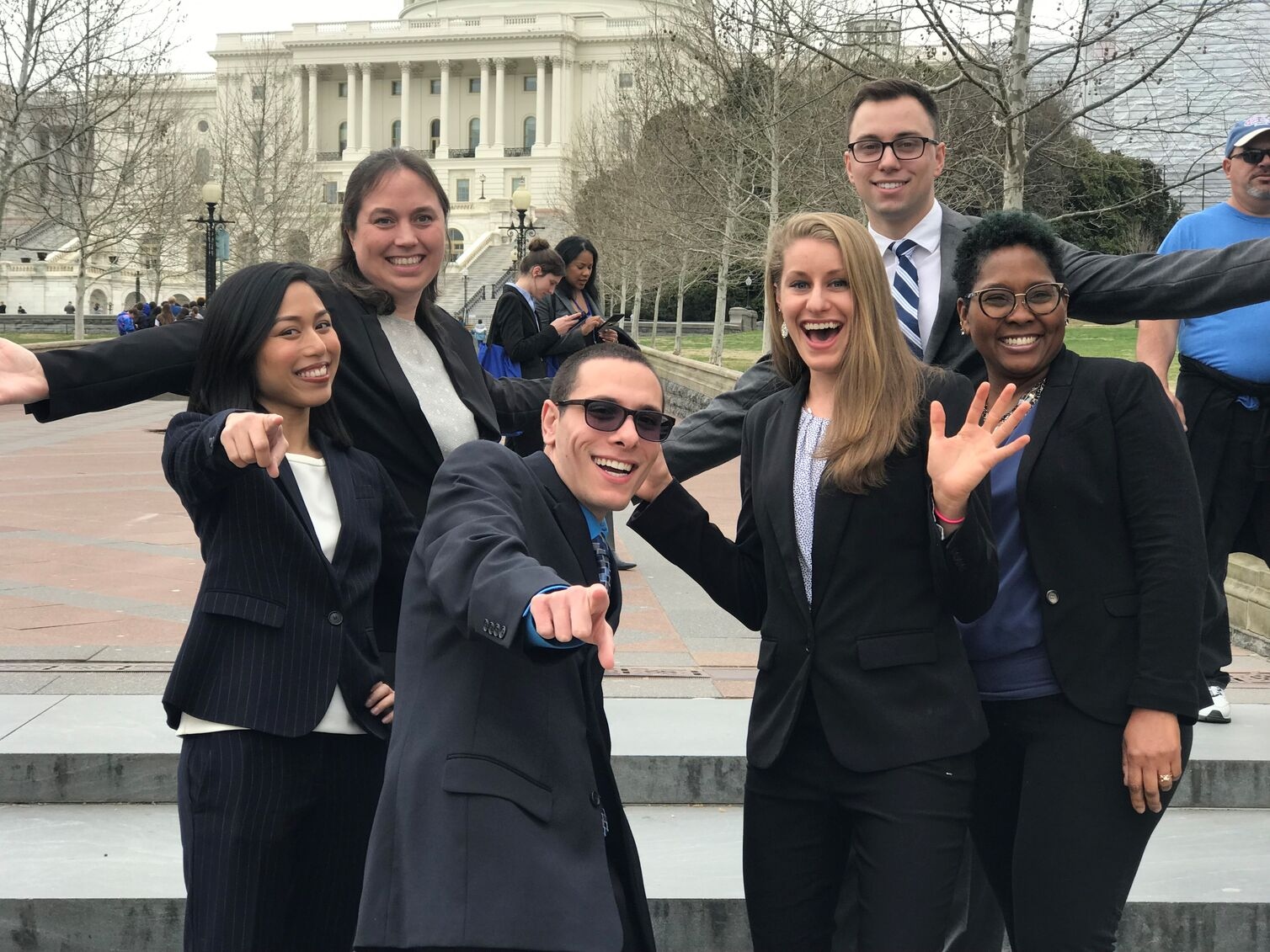 UMSON students attending the 2019 AACN conference are posing in front of steps near capitol hill.