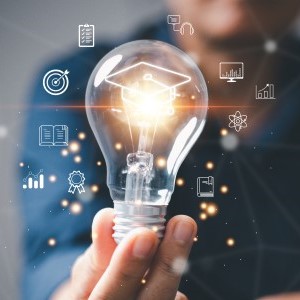 A person holding a light bulb with icons representing innovation, creativity, and research strategy