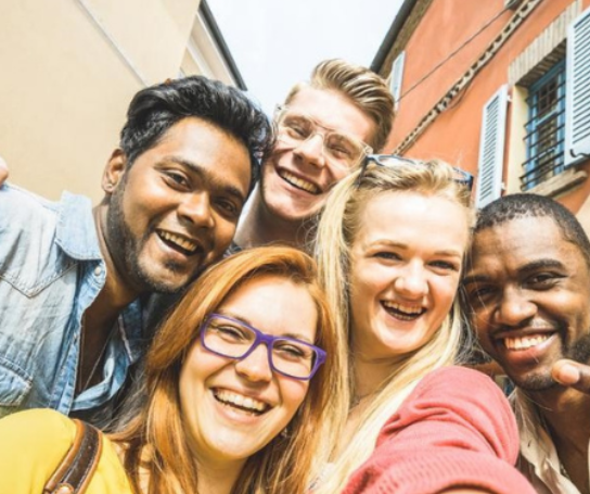 A group of students poses for a selfie