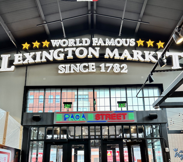 brightly colored entrance to lexington market, wording world famous lexington market since 1782