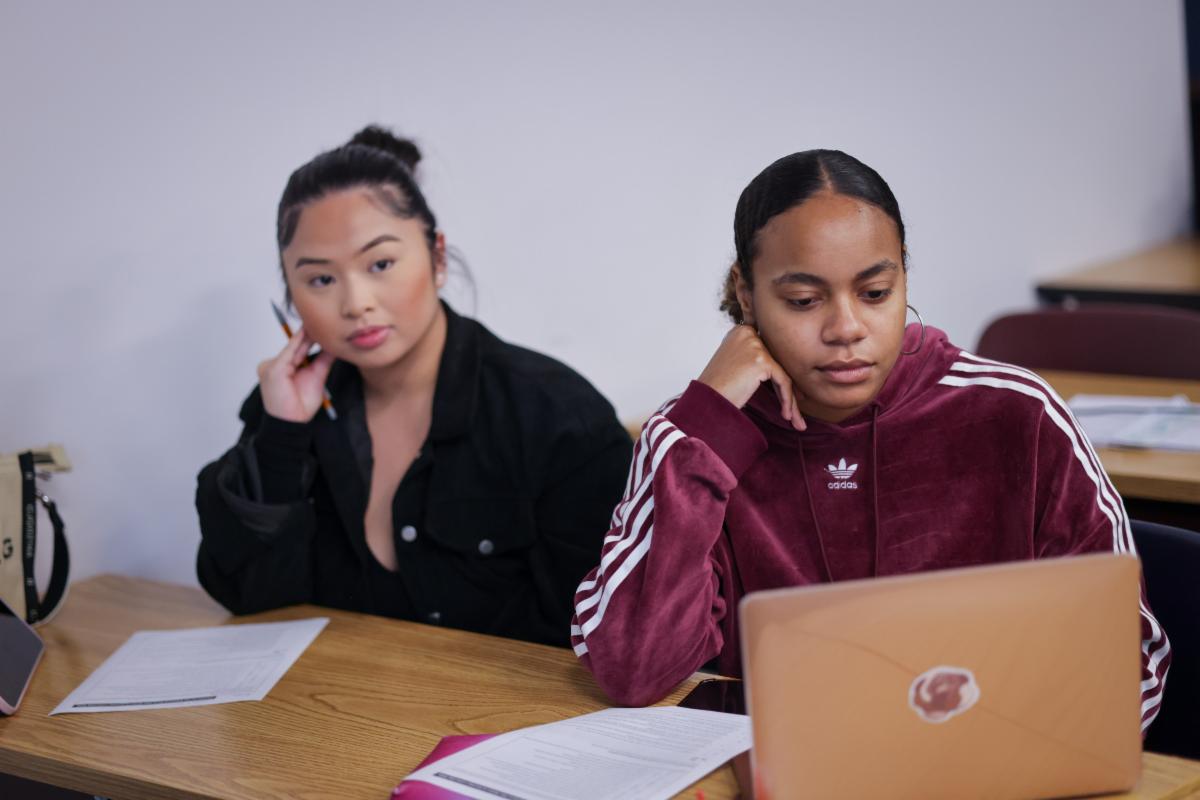 Two students in a classroom setting