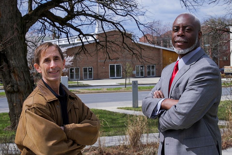 C. Daniel Mullins and Rev. Franklin Lance standing in front of a church