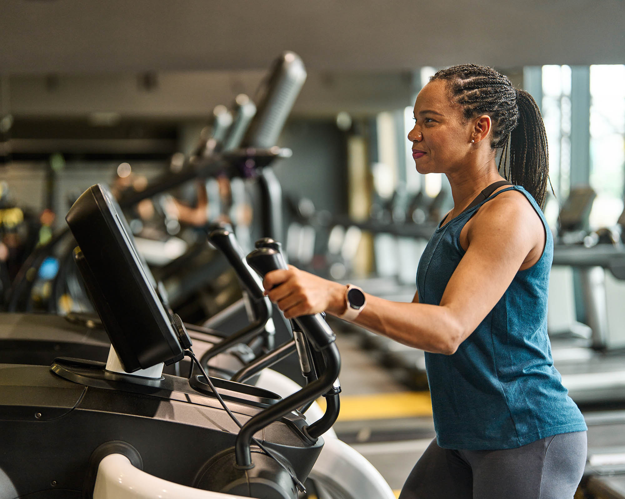 woman on a stairmaster in a gym