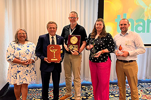 Cherokee Layson-Wolf, Joseph DeMino, Brian Hose, Amy Howard, and Mark Hindman holding awards.