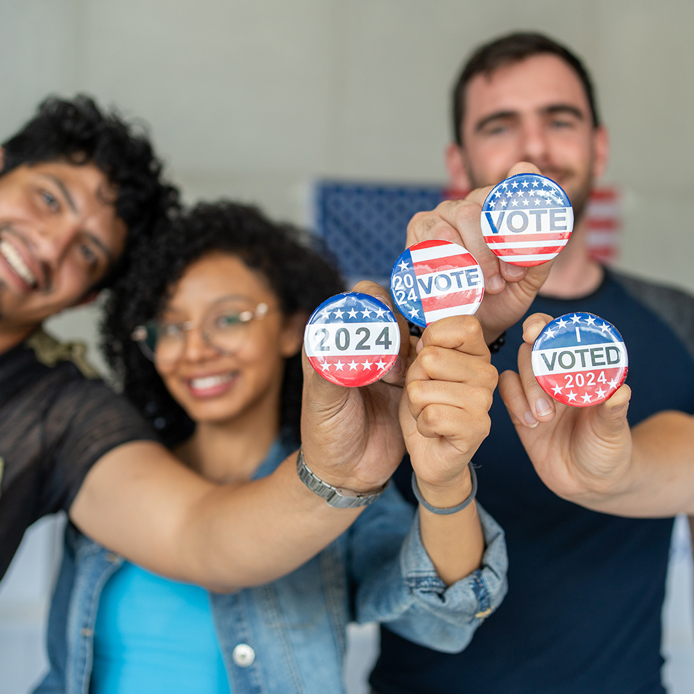 diverse group of people individually holding buttons that read 2024, 2024 vote, vote, and I voted 2024