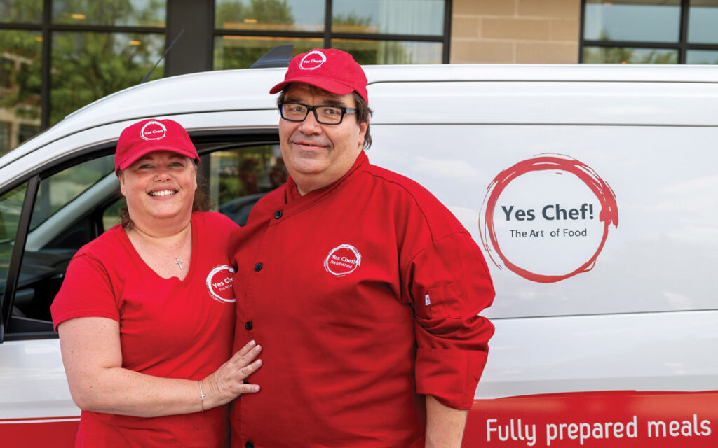 Owners of Yes Chef! Clint and Jodie Roze, standing in front of their van