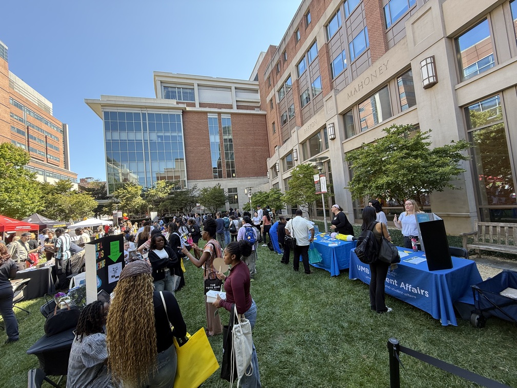 The Campus Involvement Fair on the School of Nursing Lawn. Students and staff stand near tables advertising resources, programs, and student organizations at the University of Maryland, Baltimore.