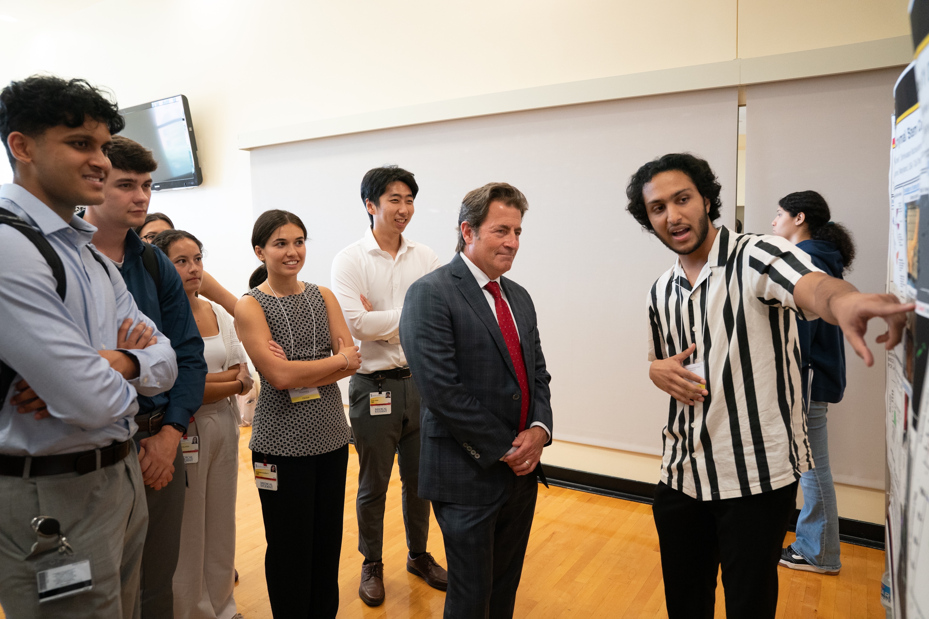 School of Medicine Dean Mark Gladwin with students