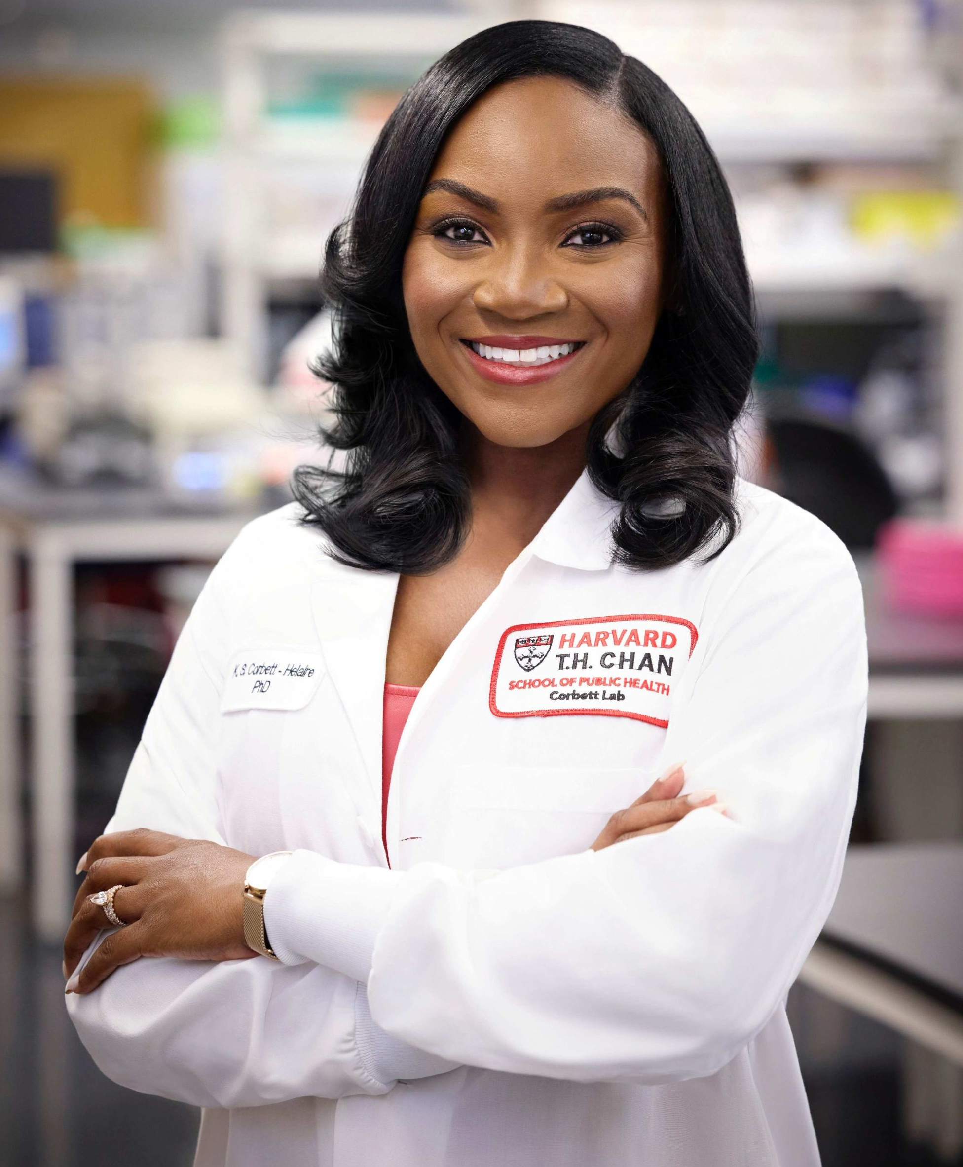 Photo of Dr. Corbett-Helaire in a lab coat