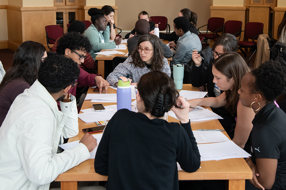 Students sitting around a table talking