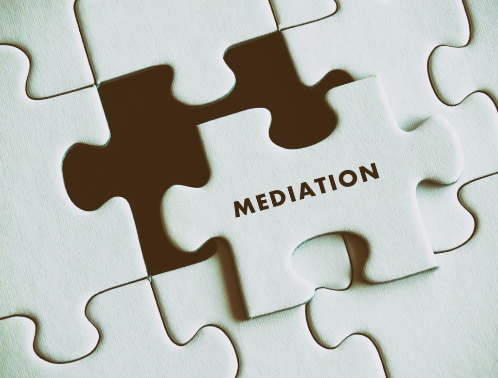 The word Mediation on a puzzle piece in a white puzzle