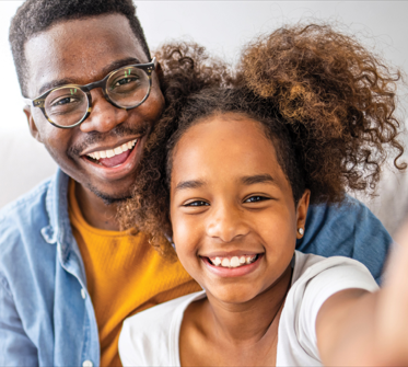 man and girl smiling