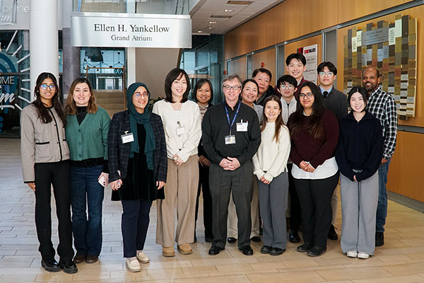 Group of student presenters and faculty from the Regulatory Science competition standing together in the Ellen H. Yankellow Grand Atrium in Pharmacy Hall