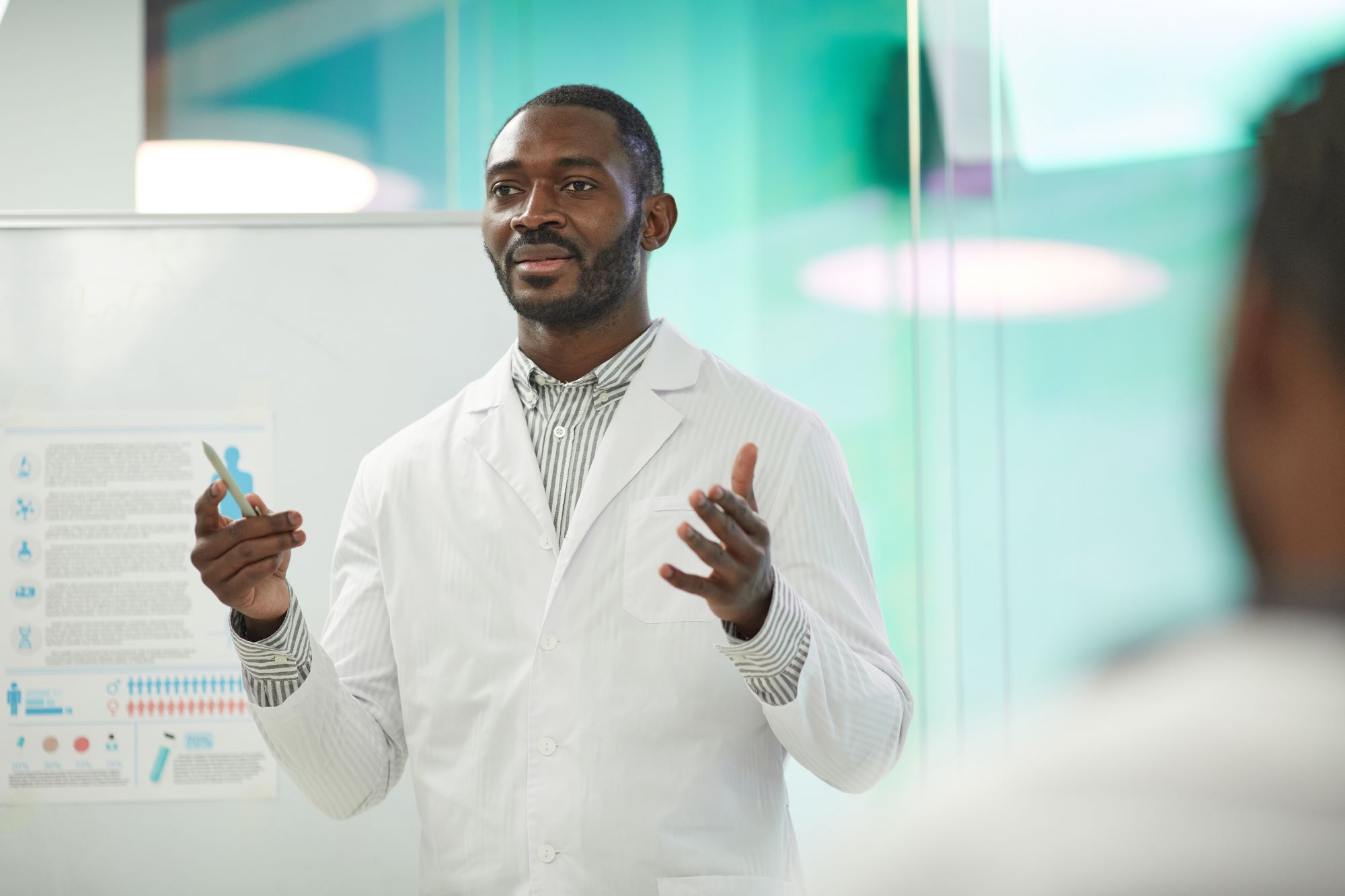 man in lab coat teaching