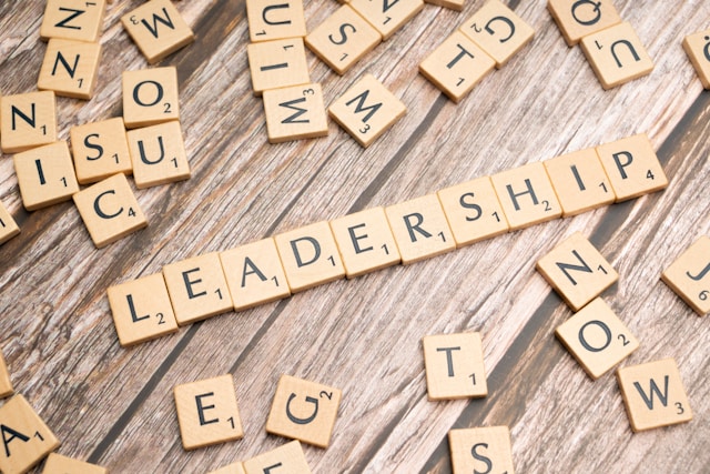 Scrabble tiles spell out the word leadership