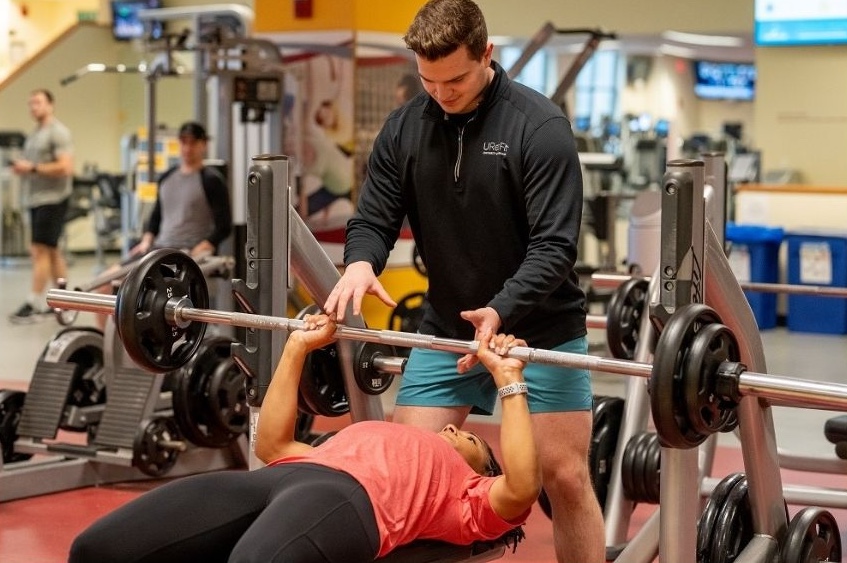  two people lifting weights together