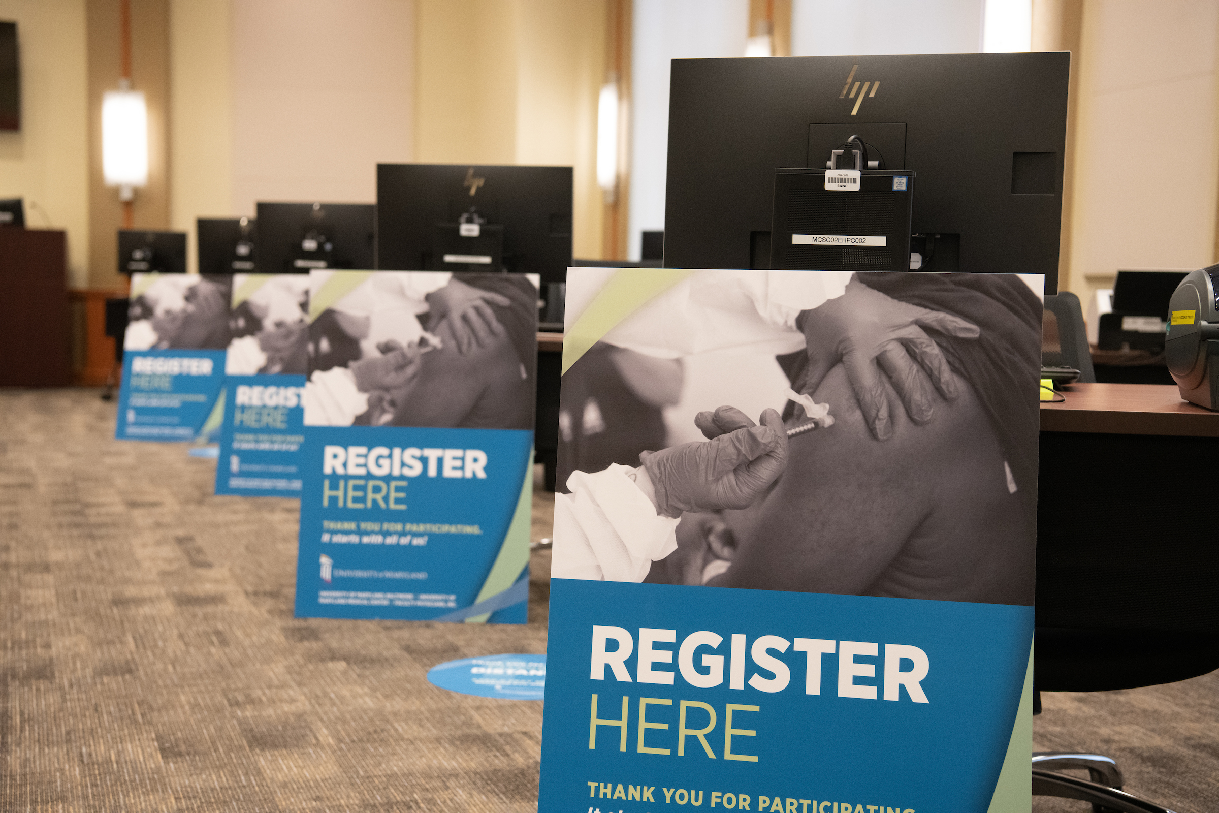 register signs at vaccine clinic