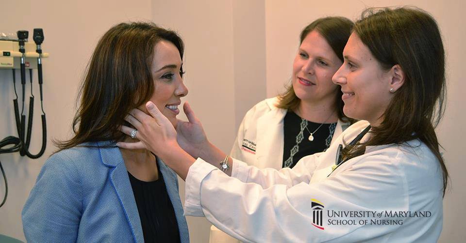 a nurse performs an exam while a preceptor watches