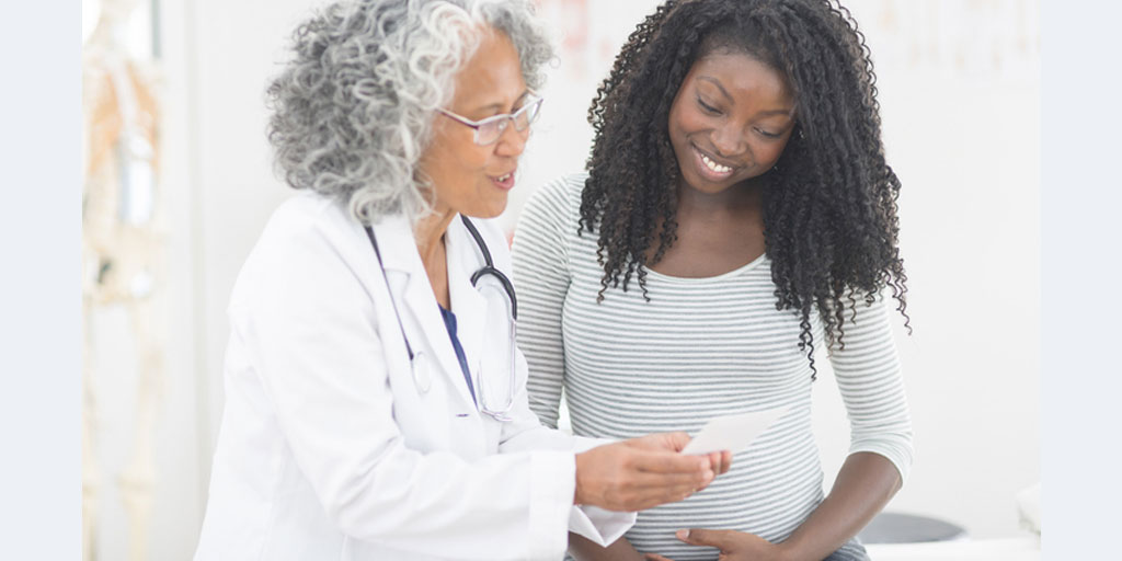 provider speaking with maternal health patient