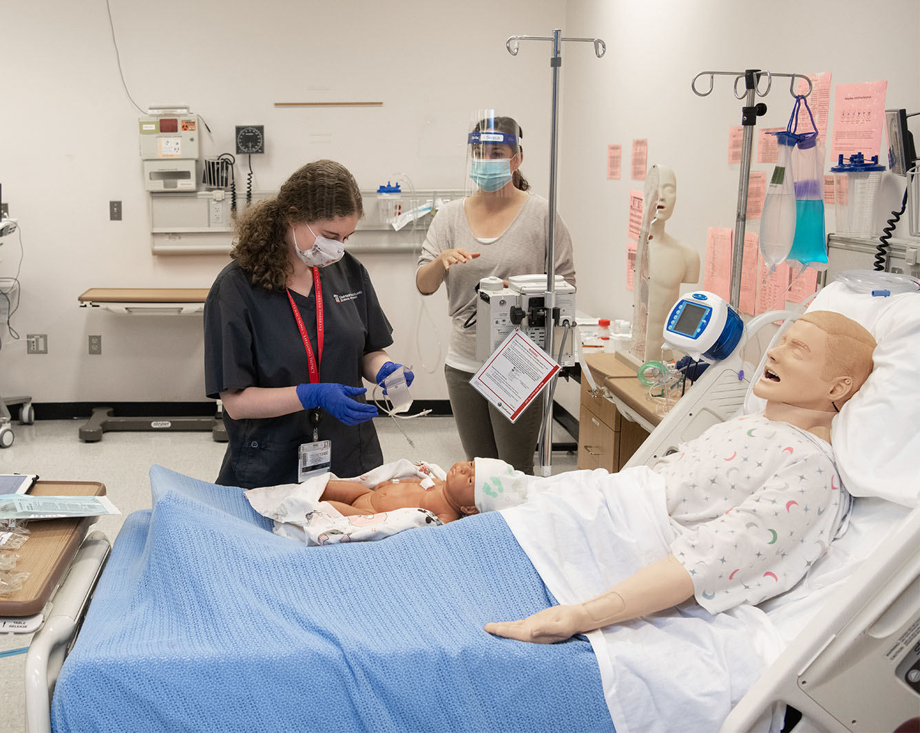 Student and faculty in Sim lab