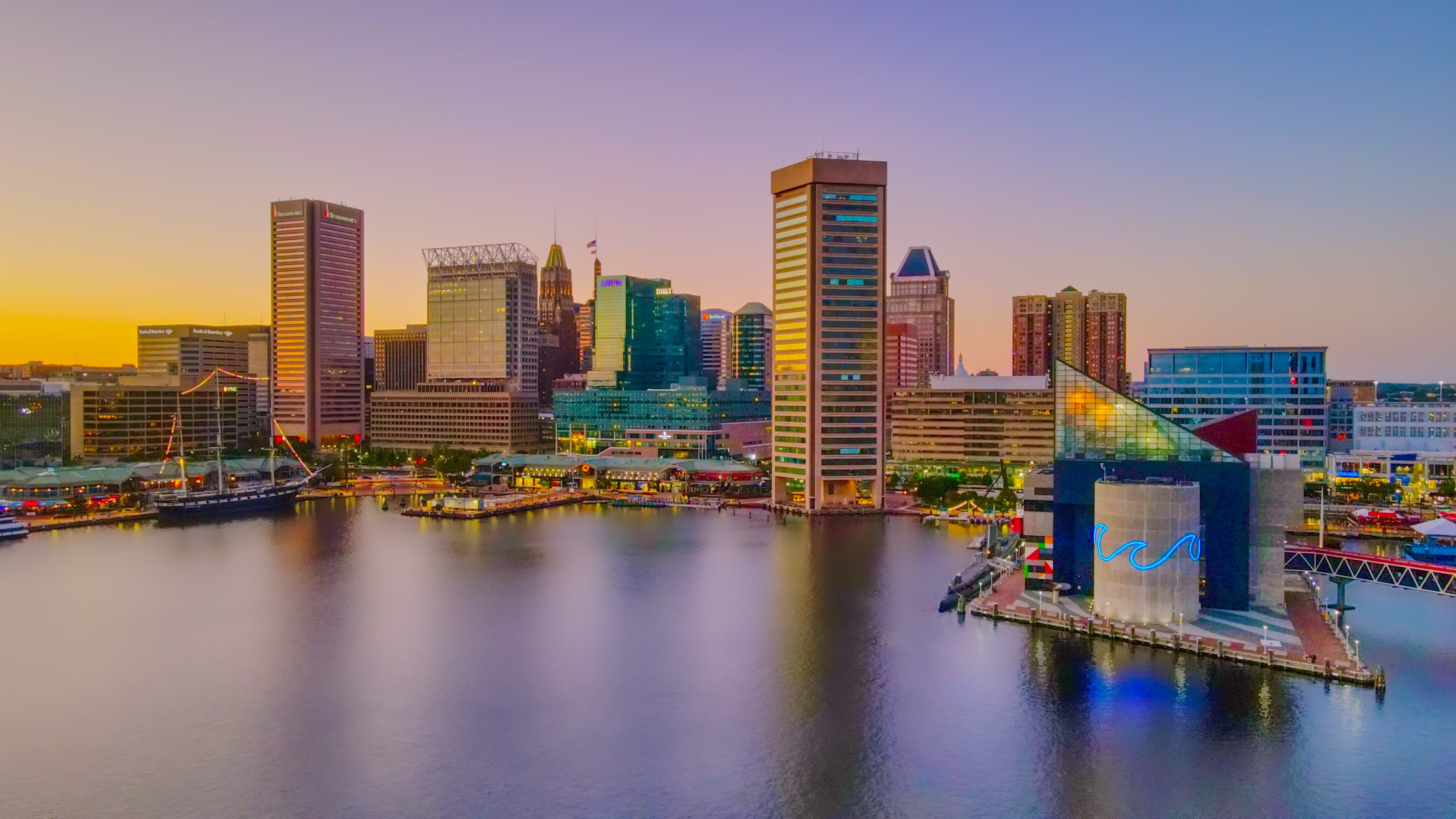 Baltimore's skyline and inner harbor at dusk.