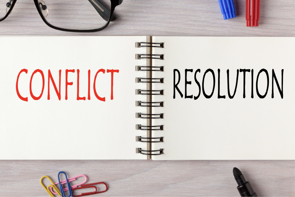 Conflict Resolution written in notebook