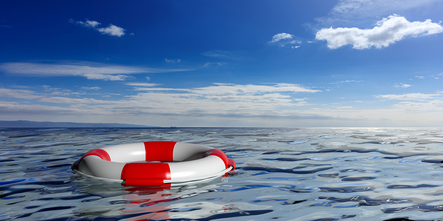 life-buoy-on-blue-sea-background