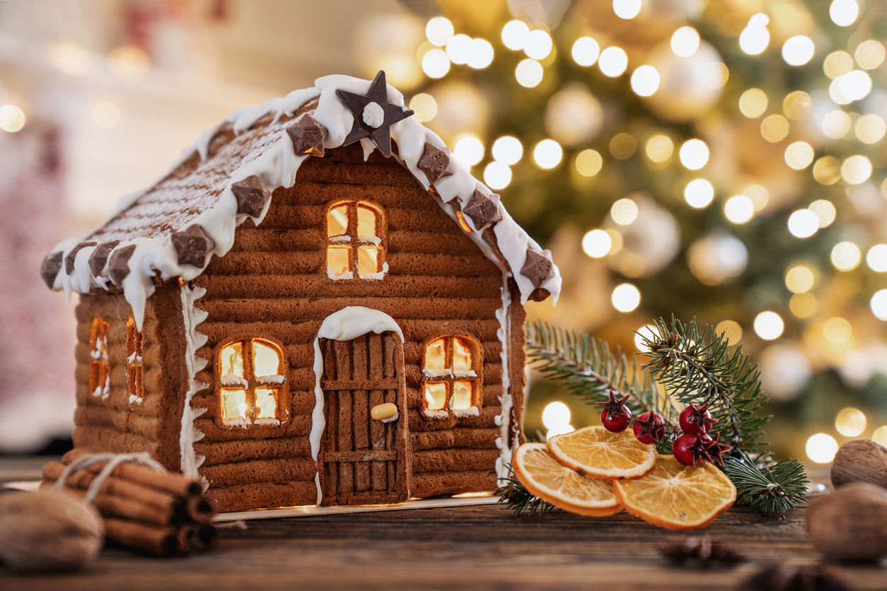 A gingerbread house with festive lights and decorations