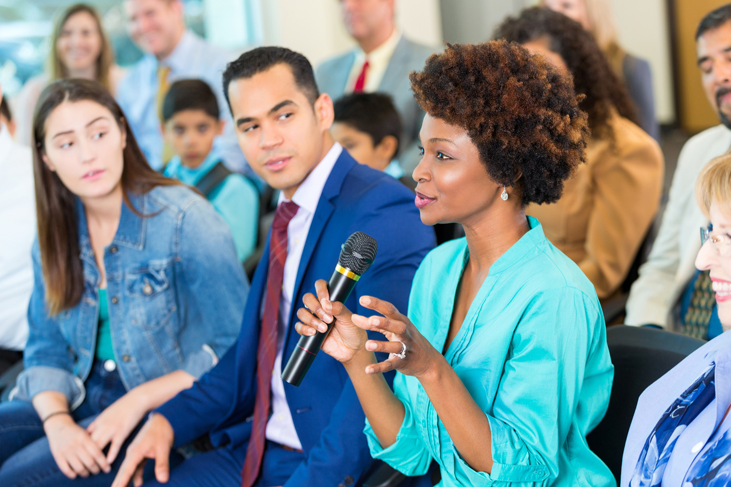 woman with microphone in audience