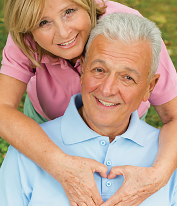 Woman caregiver with older man