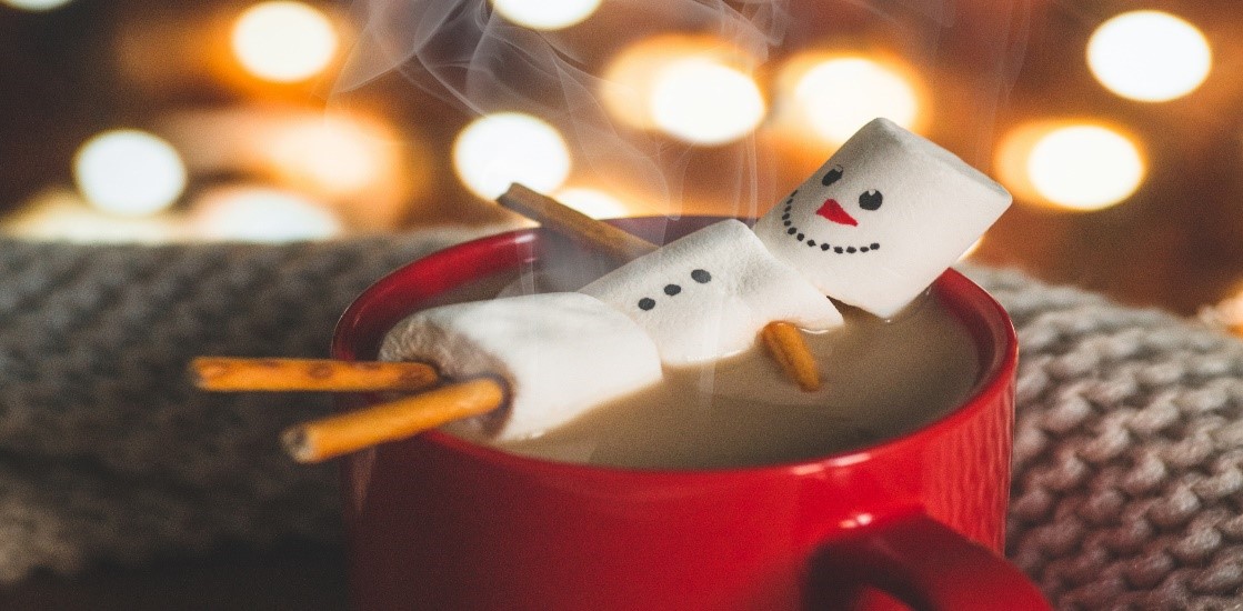 snowman floating in coffee cup