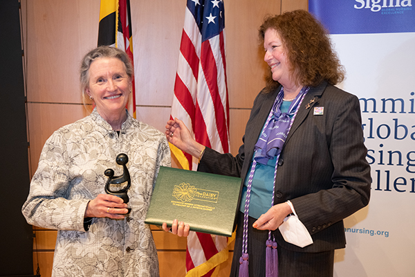 Sweeney presenting award to Kirschling