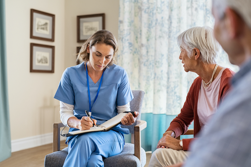 Nurse talking to patient and family member
