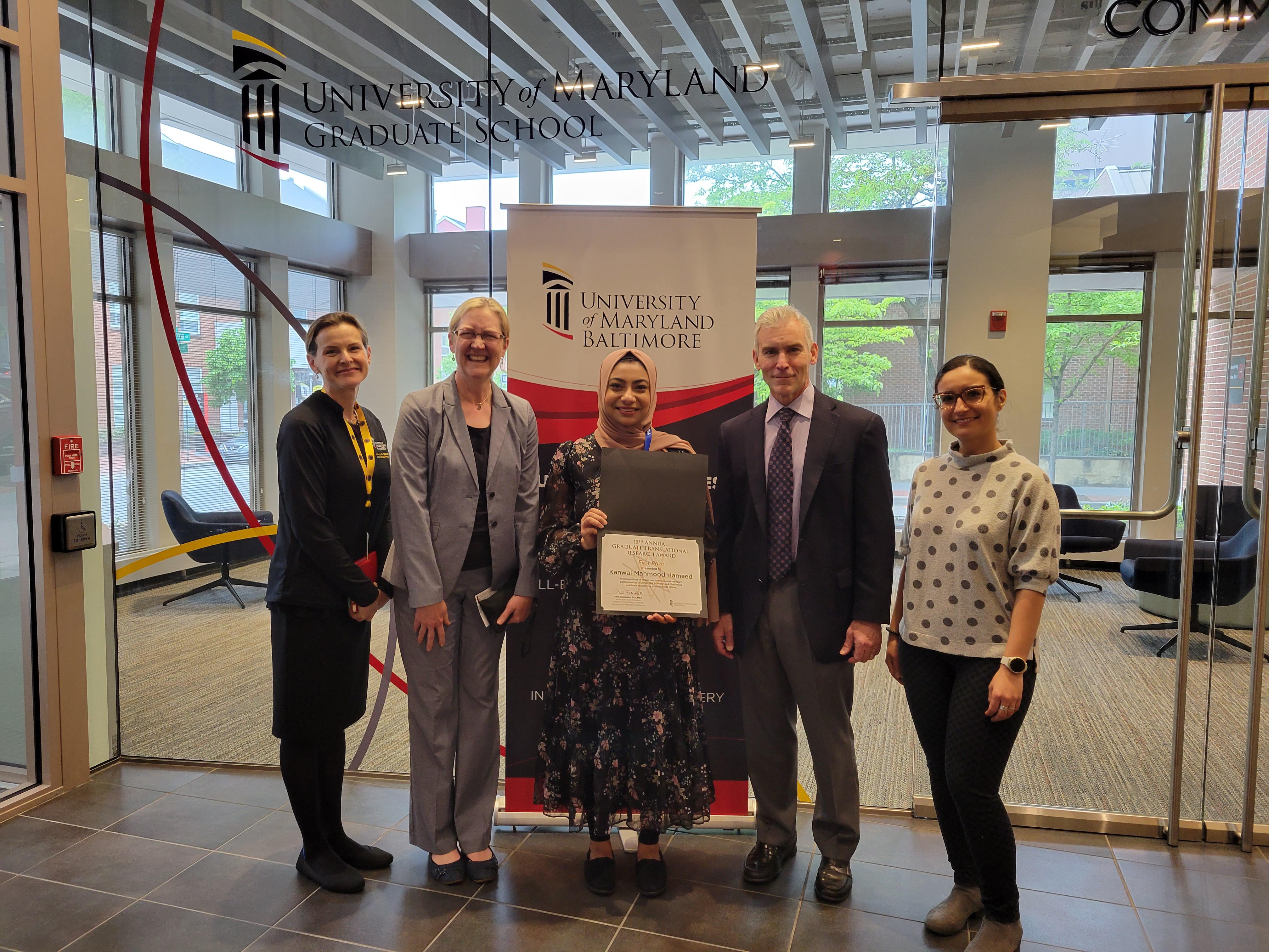 Kanwal Mahmood Hameed (center) with UMB's tech transfer team