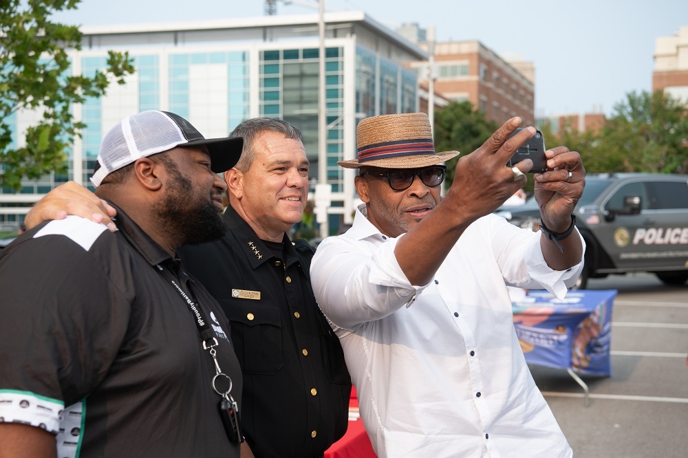 Chief Leone poses for a selfie with community members