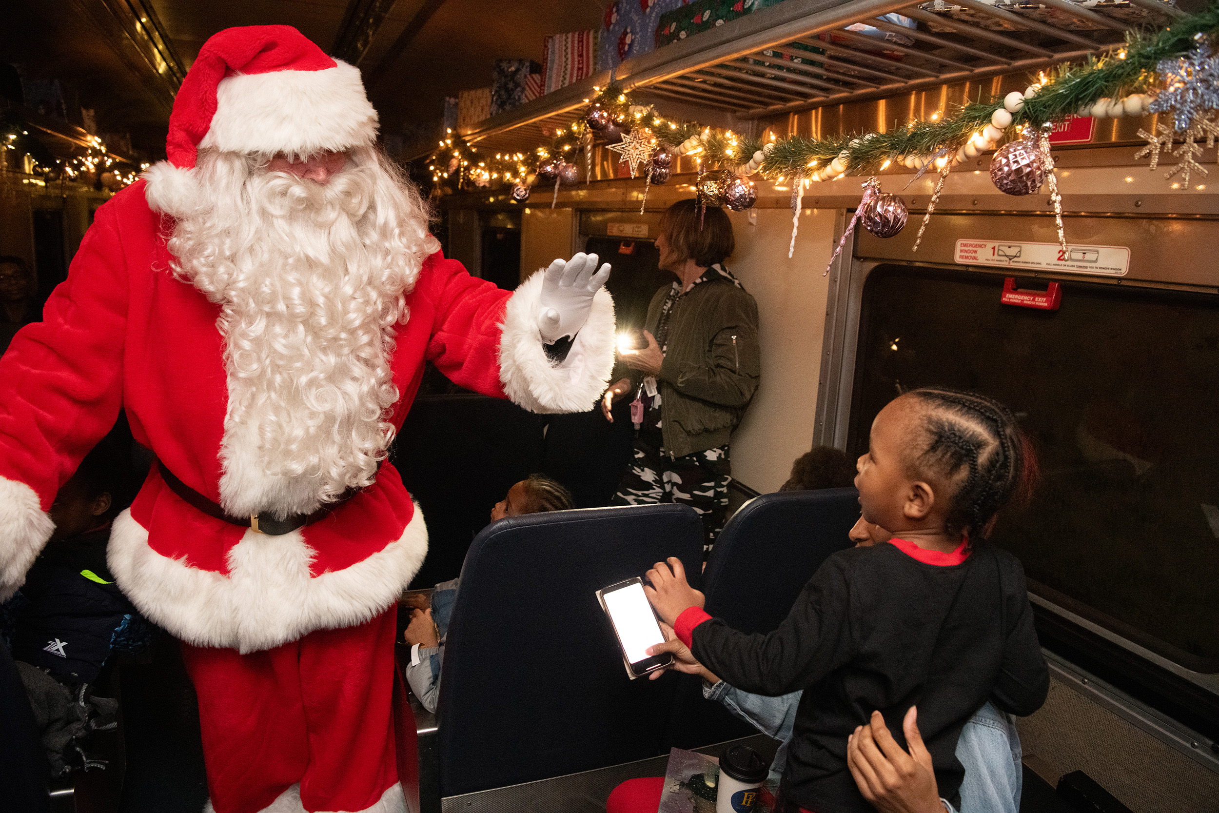 Santa Claus greets children on the Polar Express train ride at the B&O Railroad Museum