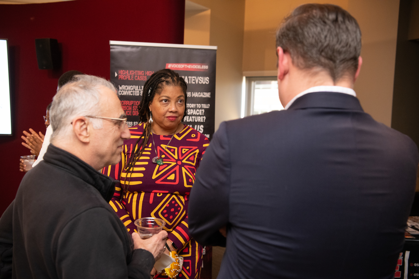 Nadine Finigan-Carr, PhD, MS, speaks with guests at the open house, including Thomas M. Scalea (left), MD, FACS, MCCM, physician-in-chief of the R Adams Cowley Shock Trauma Center.