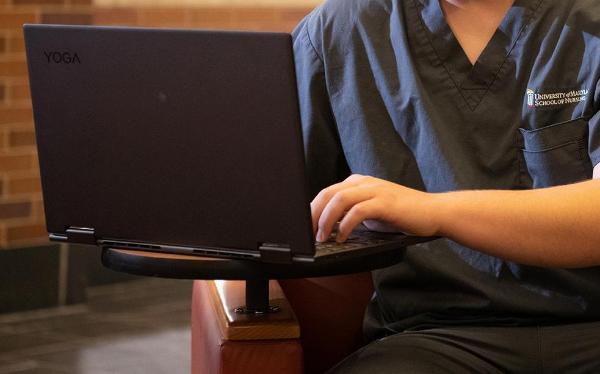 nursing student using laptop