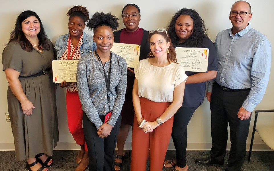 From L to R, FRONT: Jahmoy Colquhoun, Nicole Palmore, BACK: Anna Borgerding, Danielle Hill, Shakiara Seals, Krishauna Greene, Scott Bitner, AWAY: Latoya Ludd, Lisa Crawley, Dawn Rhodes, Nate Holloway