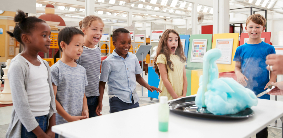 Kids having fun watching a show in a science center