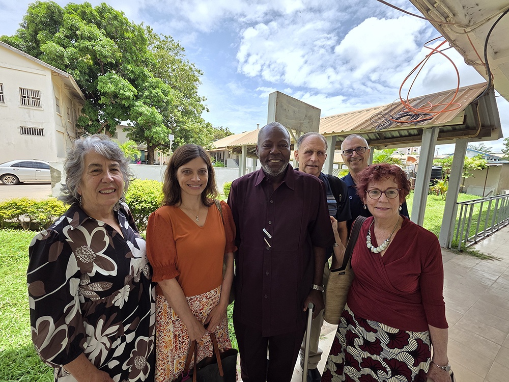 group of people stand outside in The Gambia